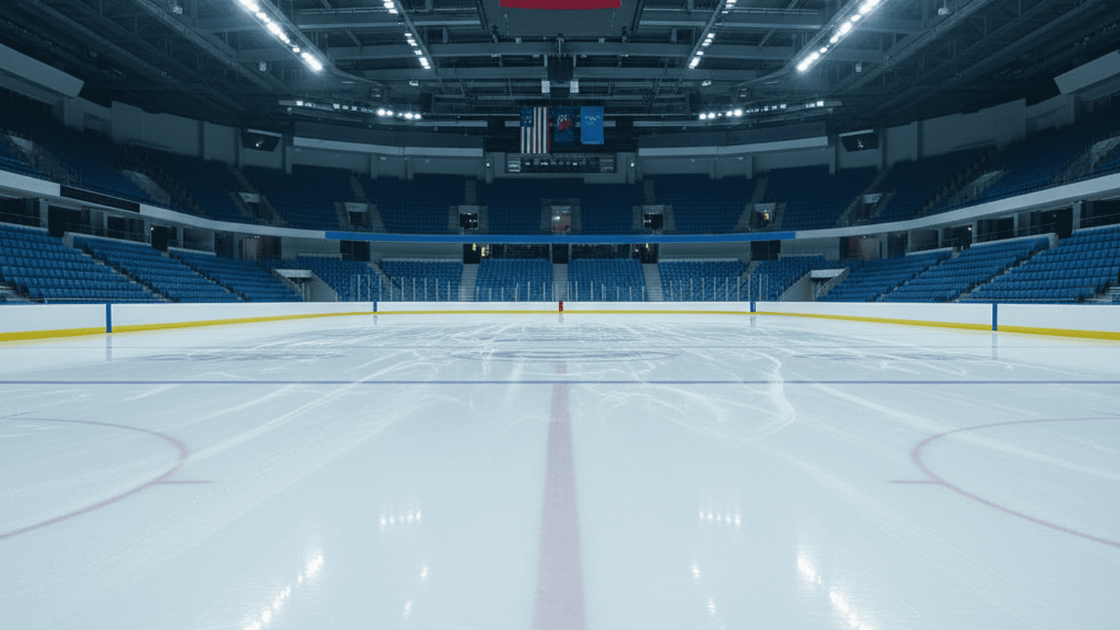 A bright and empty ice skating rink prepared for a professional competition.