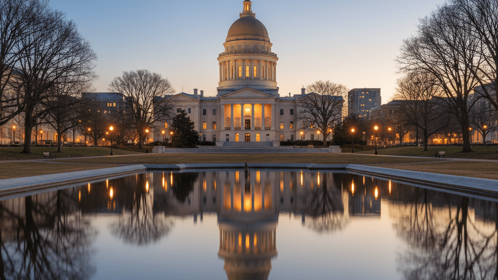 The Virginia State Capitol building stands illuminated at dusk in Richmond.
