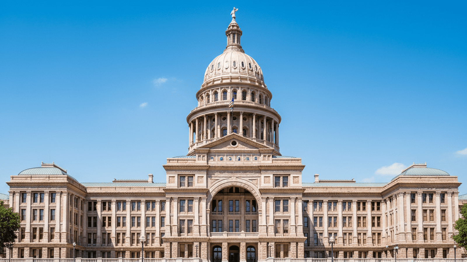 A government building in Texas stands under a clear sky, representing the focus on immigration enforcement in the Senate race.