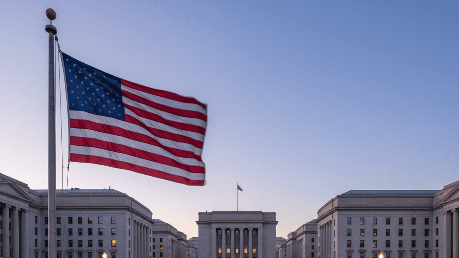 A view of a federal building in Washington, D.C. under a clear evening sky.