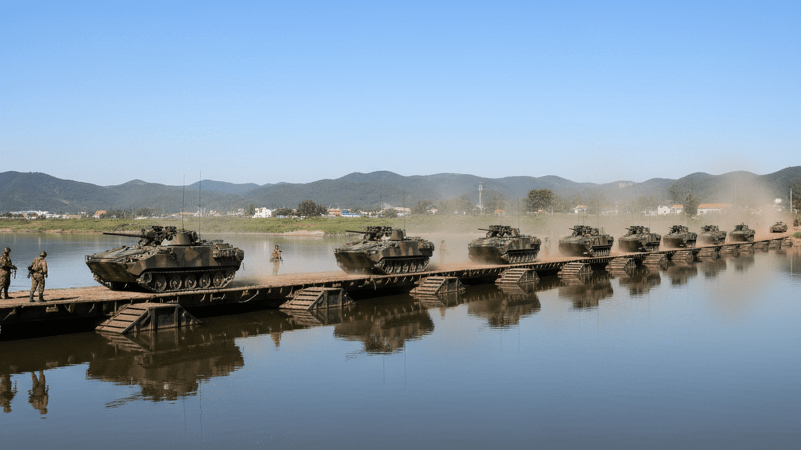 U.S. Army armored vehicles cross a floating bridge during the Freedom Shield military exercise in South Korea.