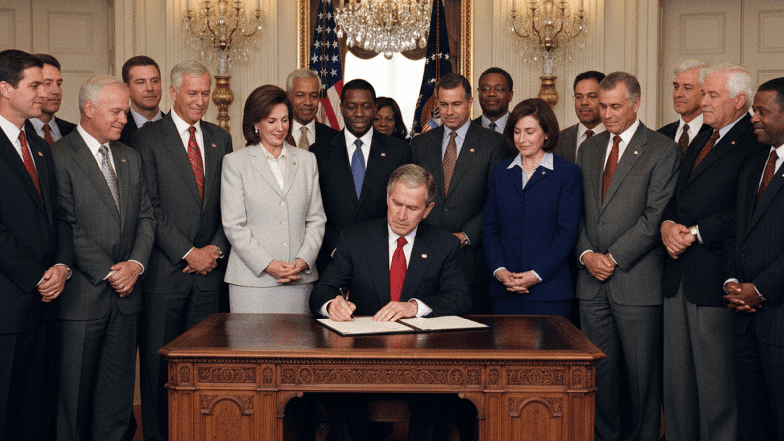 President George W. Bush signs the Voting Rights Act reauthorization in 2006 surrounded by a bipartisan group of lawmakers.