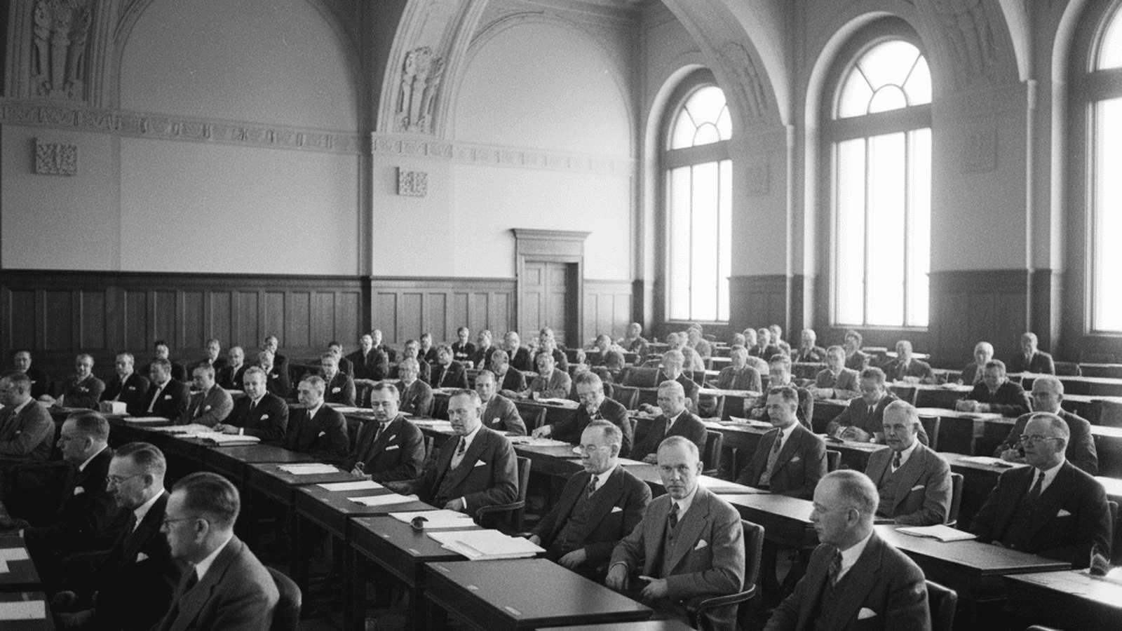 A black and white photograph of the Nebraska Unicameral Legislature in session during its inaugural year of 1937.