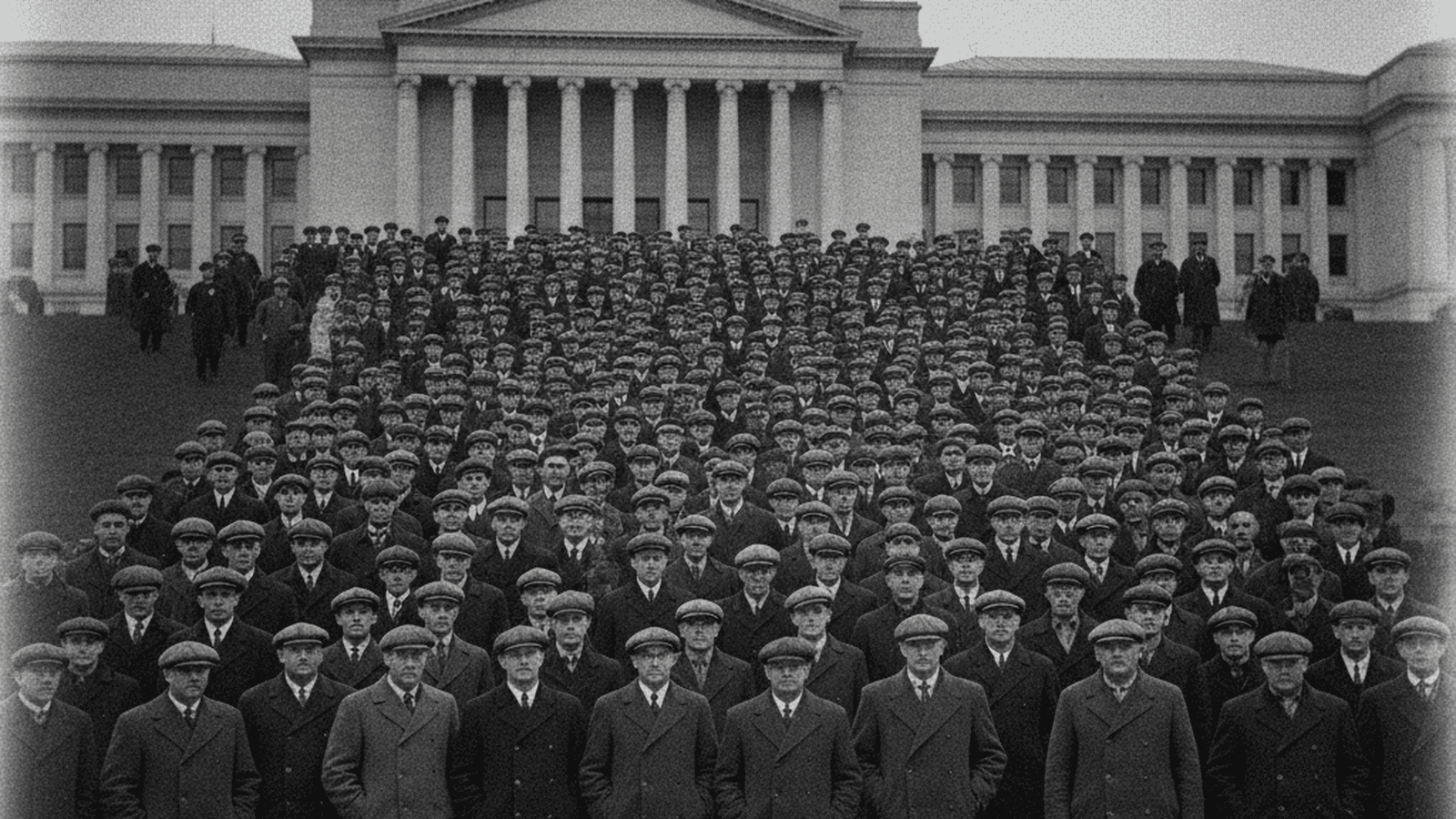 A black and white photograph of a large crowd of protesters gathered outside the Washington State Capitol in 1933.