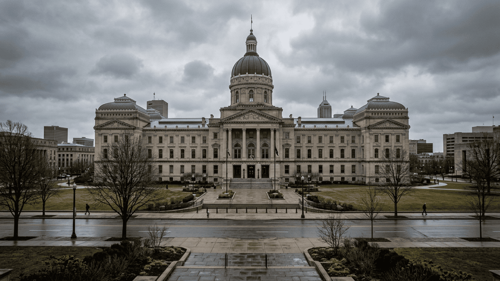 The Indiana Statehouse stands beneath an overcast sky.