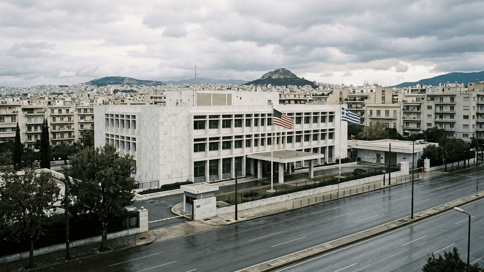 The U.S. Embassy in Athens displays Greek and American flags near its entrance.