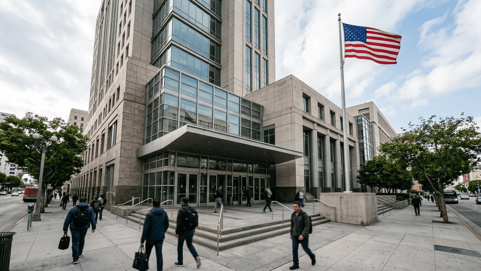 The entrance to a federal courthouse in Los Angeles with a U.S. flag outside.
