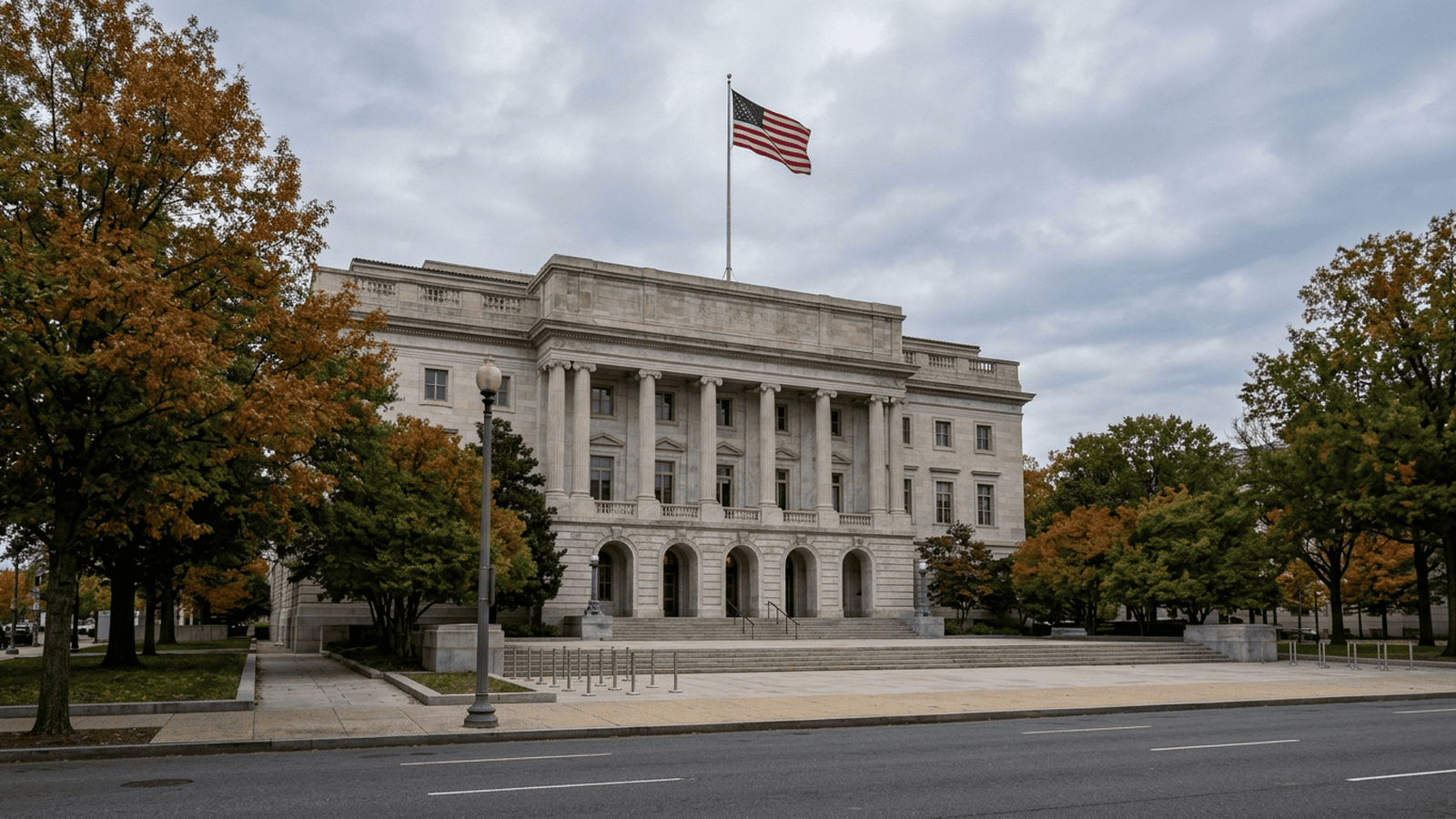 A federal courthouse stands beneath an American flag in a quiet Washington street scene.