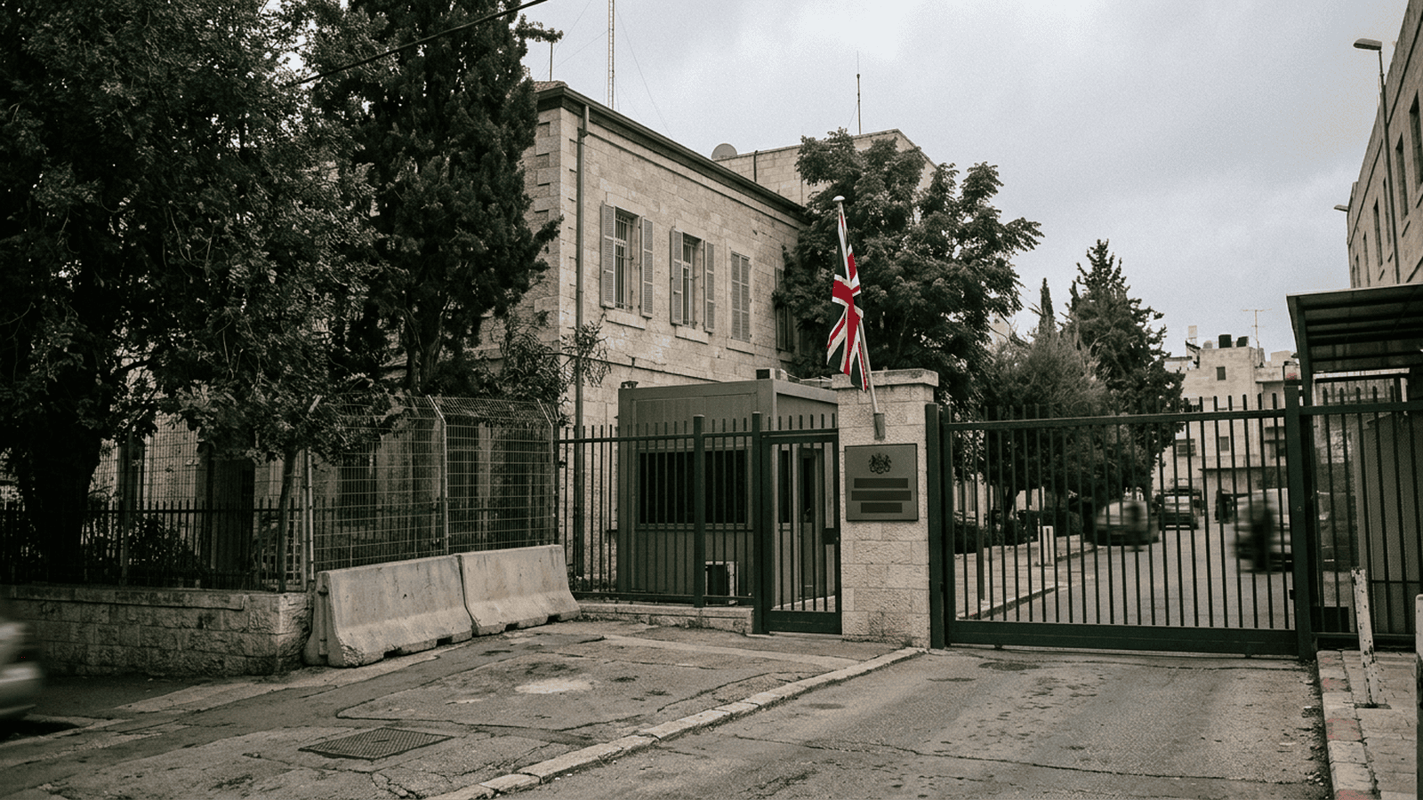A diplomatic compound in east Jerusalem with a British flag beside its entrance.